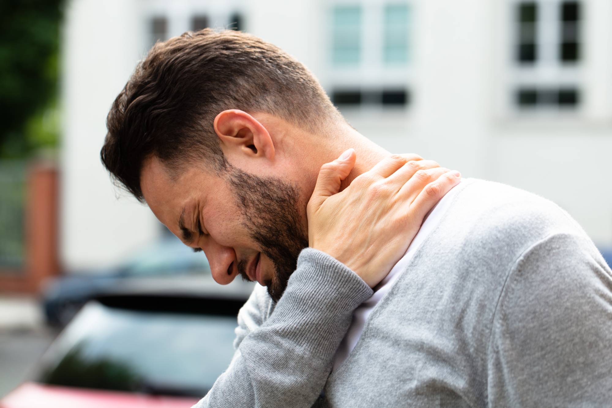 A person struggles with neck pain